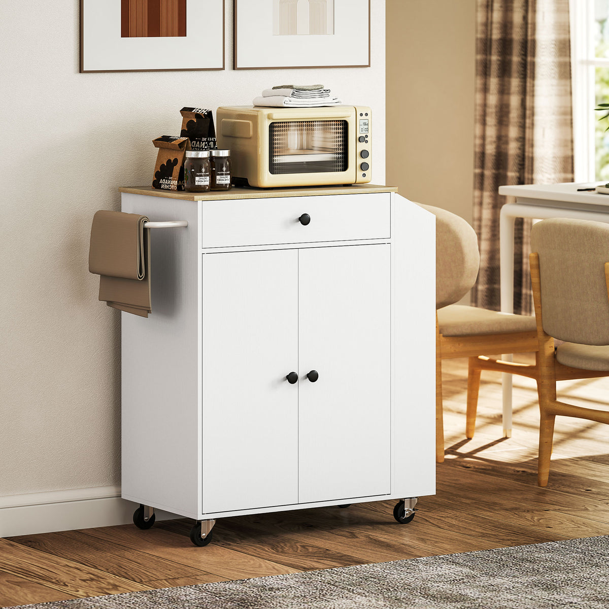 White rolling kitchen island with wood-look top, drawer, cabinet doors and side towel rack