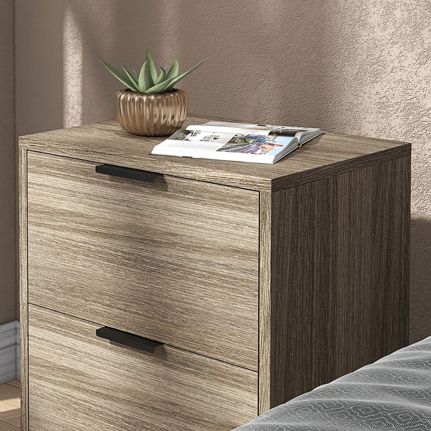 Close view of a wood-effect bedside table with two drawers and black handles