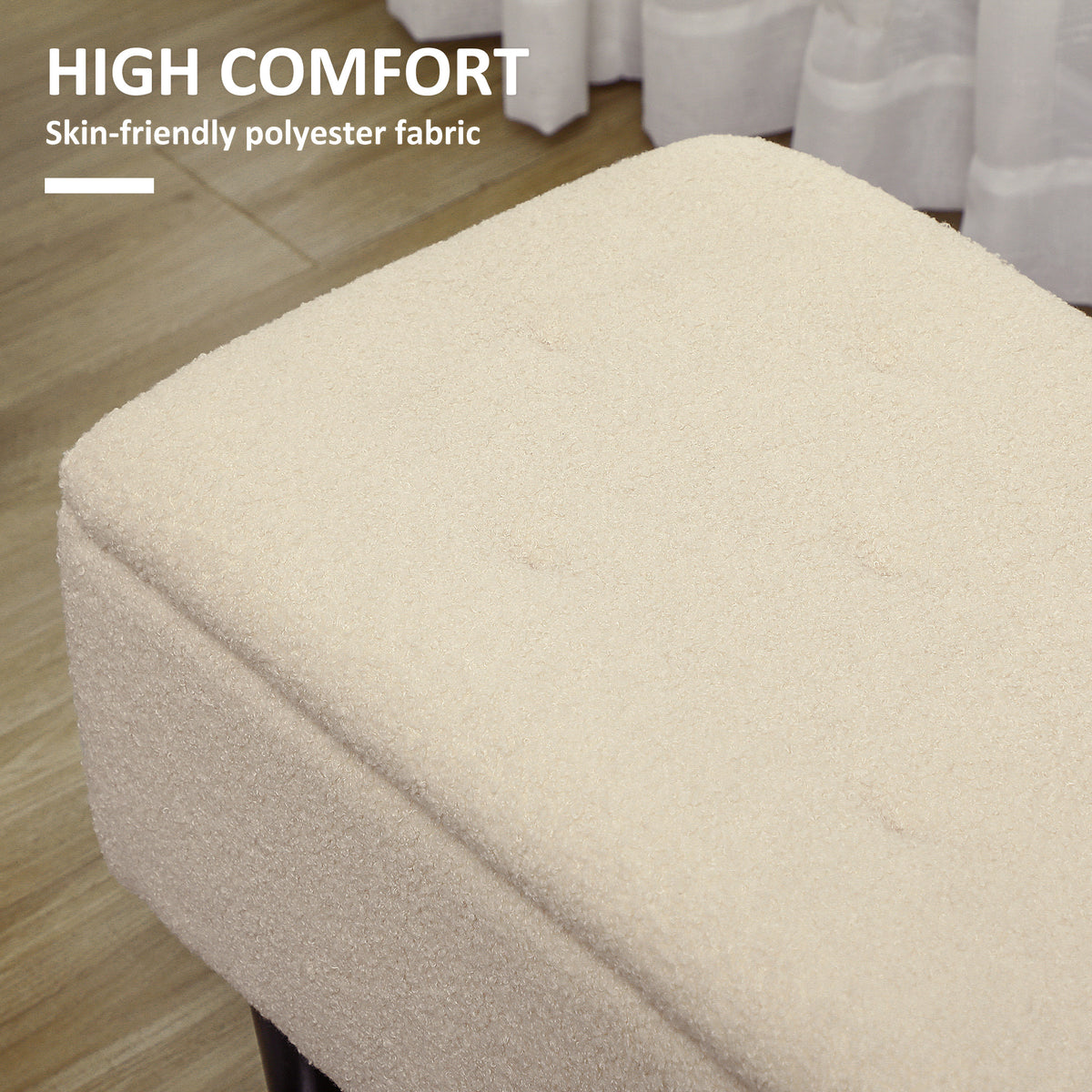 Close-up of the cream teddy fleece upholstery and padded ottoman lid