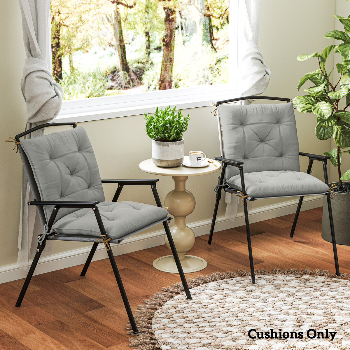 Pair of light gray tufted cushions on chairs, showing padded seats and backs