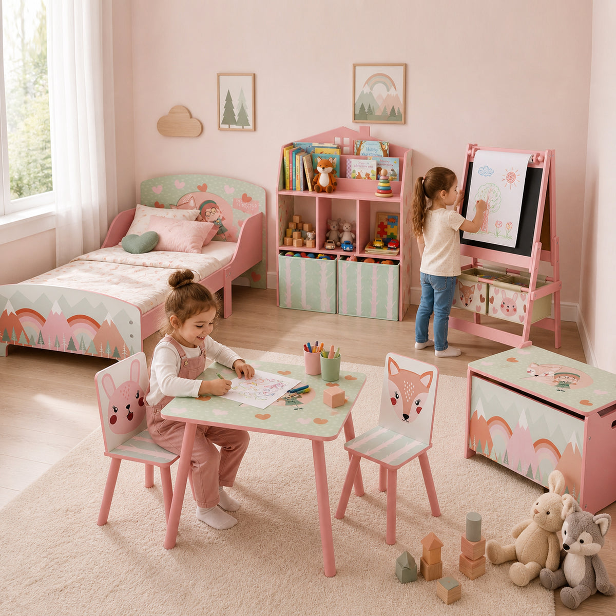 Pink toddler bed with pastel mountain-print panels in a children's bedroom