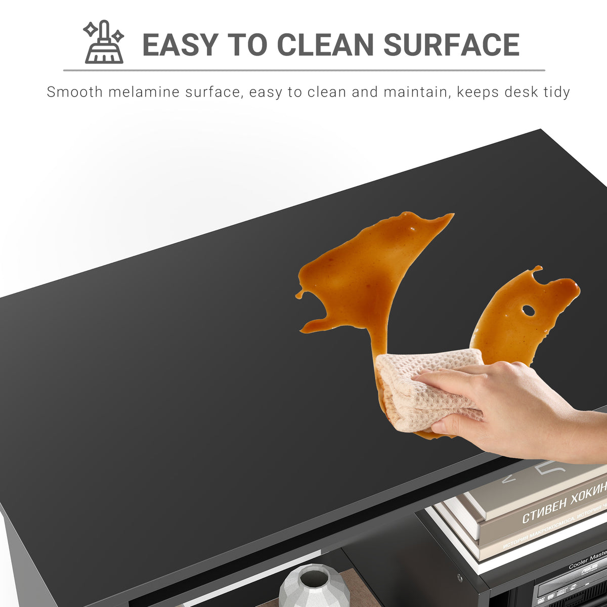 Black desk with smooth melamine top being wiped clean