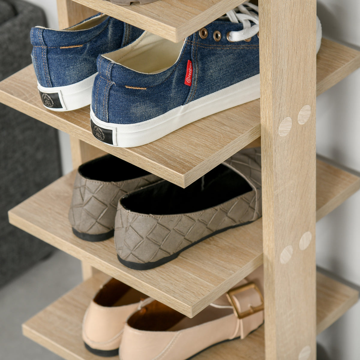 Oak shoe rack shelves with shoes stored on three tiers