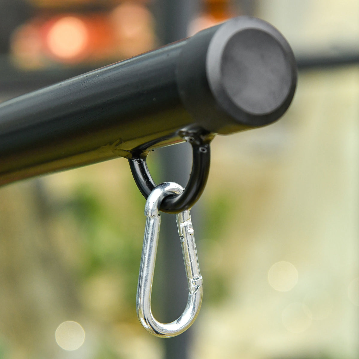 Close-up of hammock stand's steel safety hook and hanging carabiner