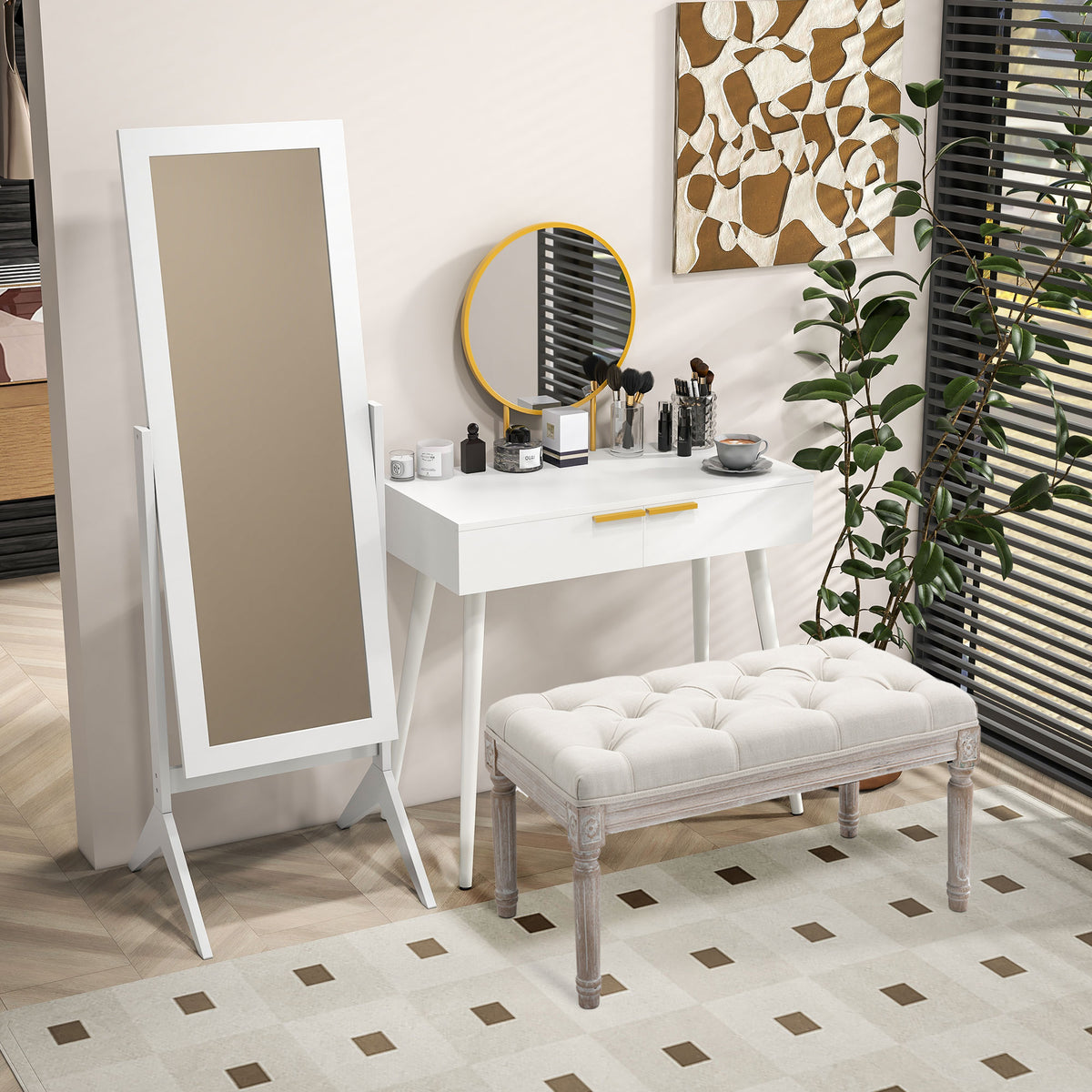 White dressing table with round mirror and gold drawer handles, styled in a bedroom