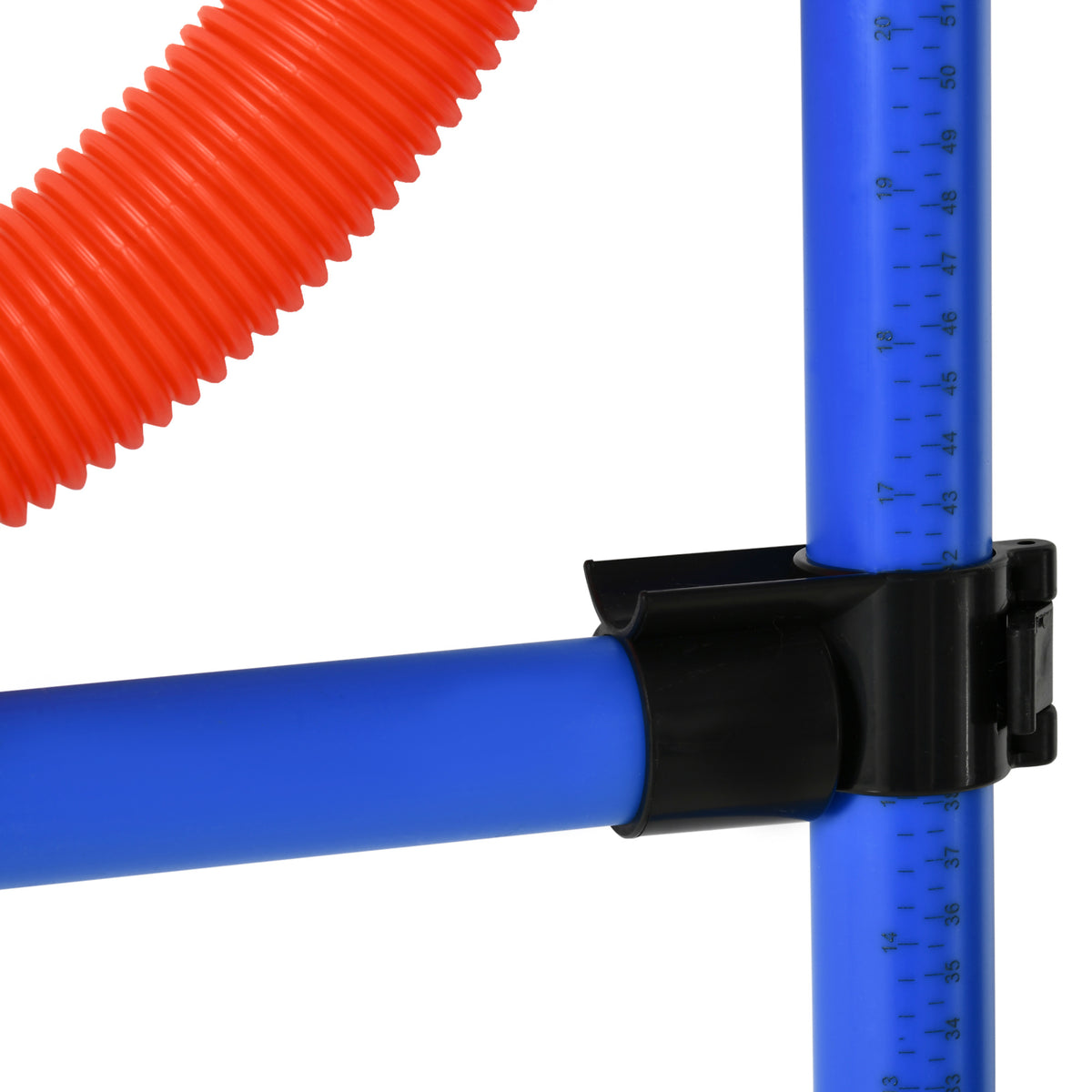 Close-up of black connector joining blue agility poles, with red flexible pole