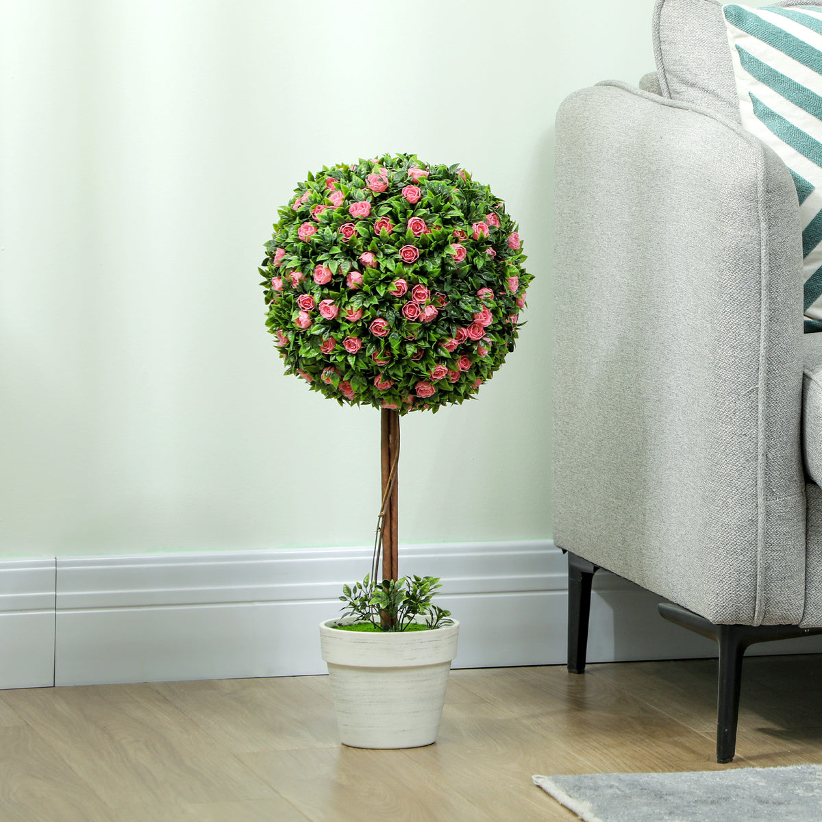 Artificial rose topiary tree with a round flower crown in a white pot