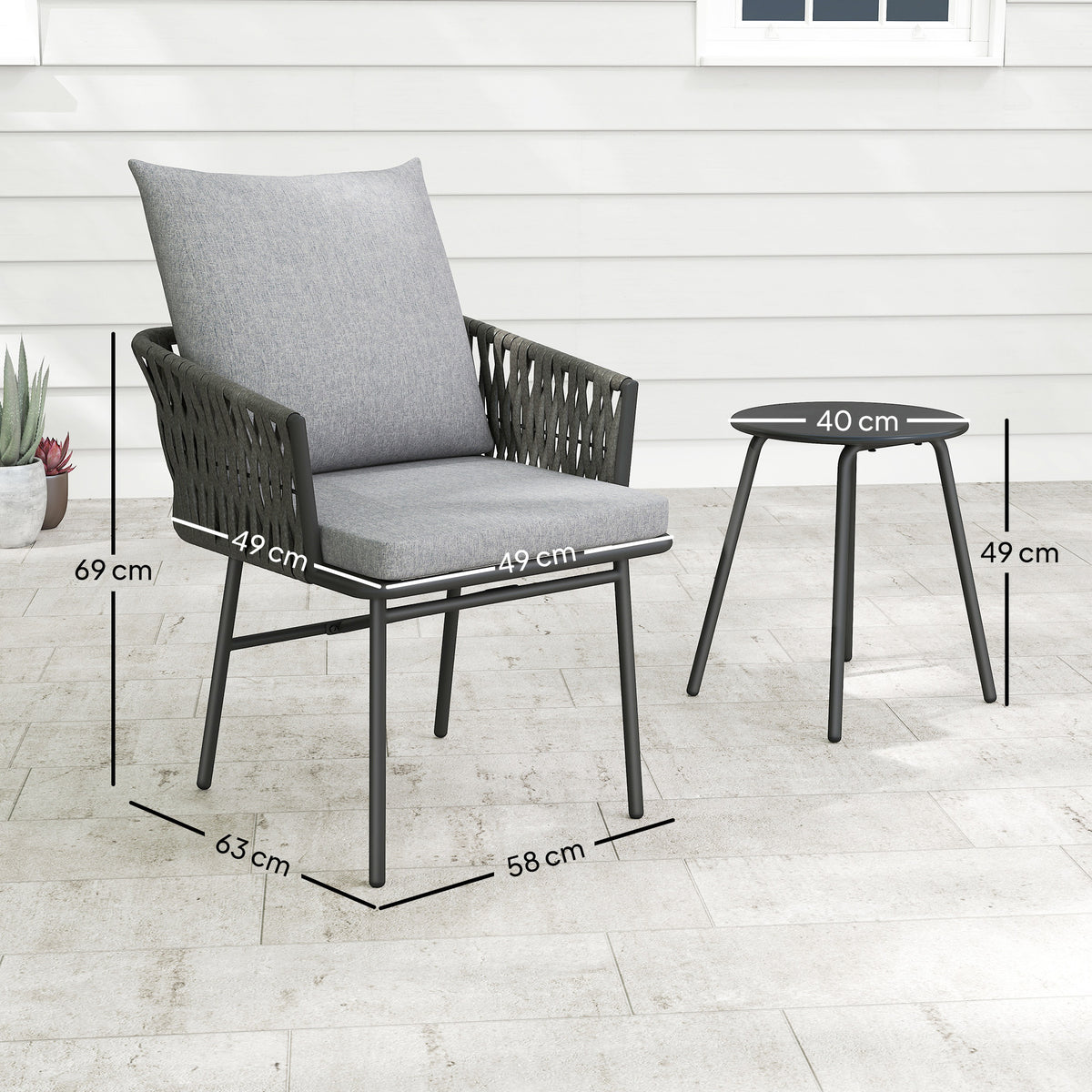 Cushioned grey rattan chair and round table with dimensions shown
