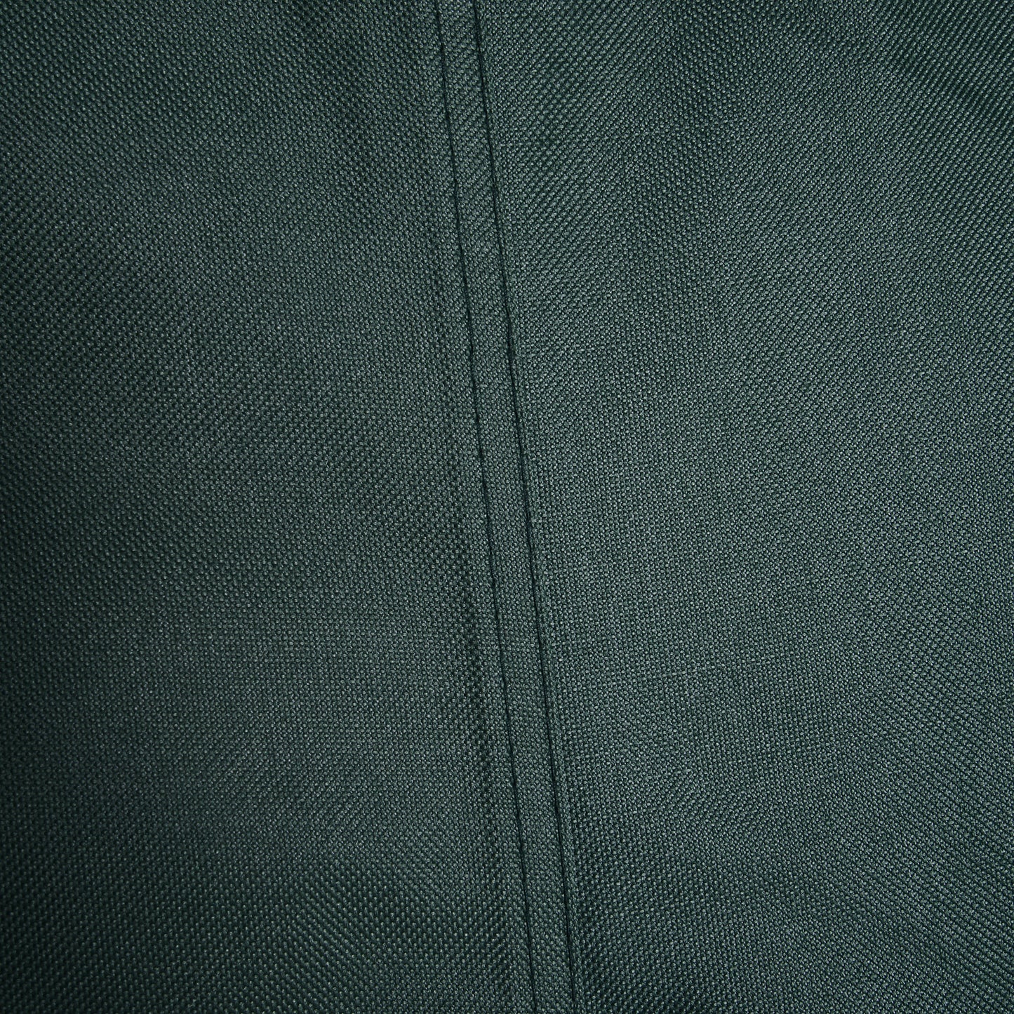 Close-up of the green cover's woven fabric and stitched seam