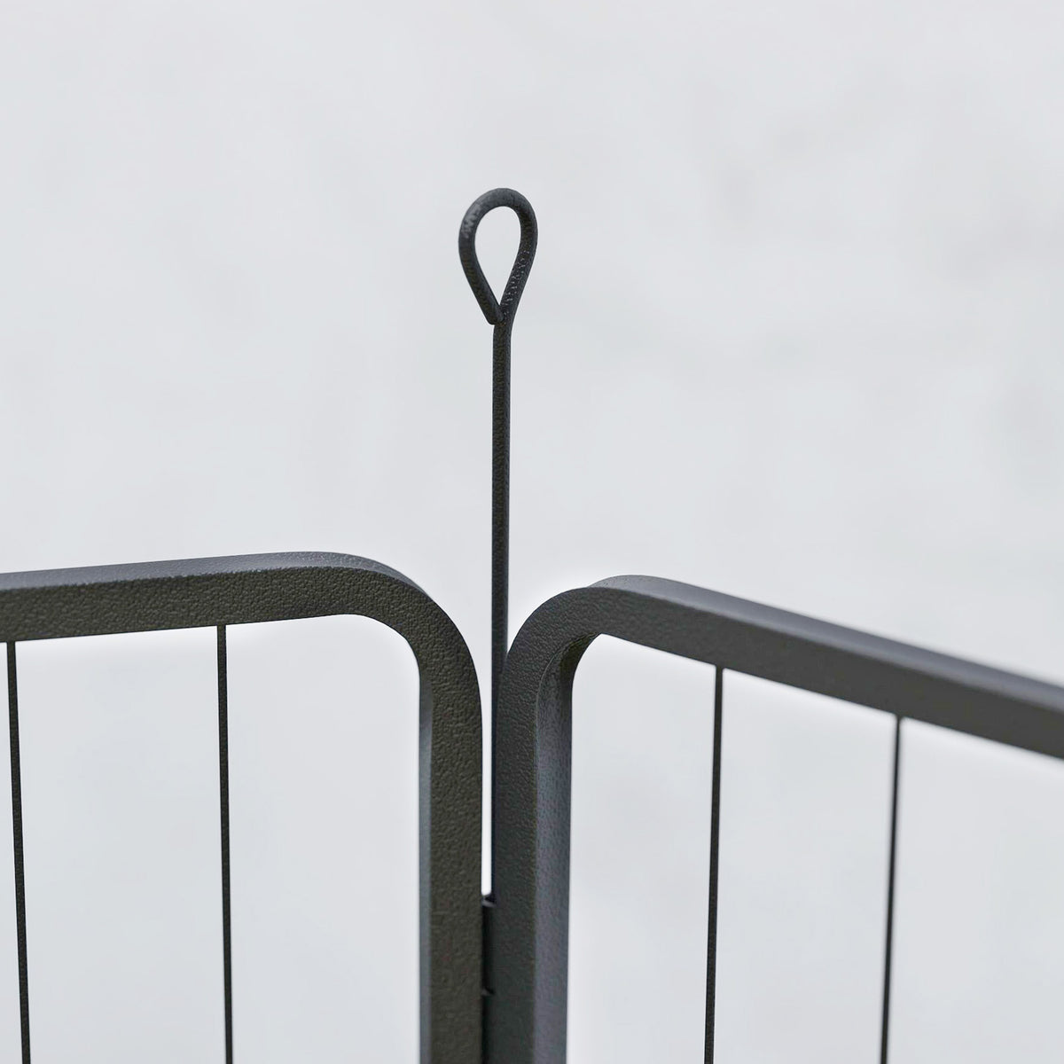 PawHut black dog playpen panel joint secured by a looped ground stake