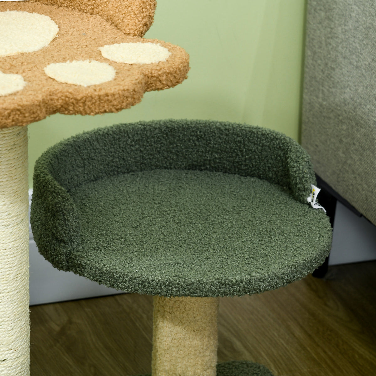 PawHut cat tree close-up of the green raised bed and tan sisal-wrapped support post