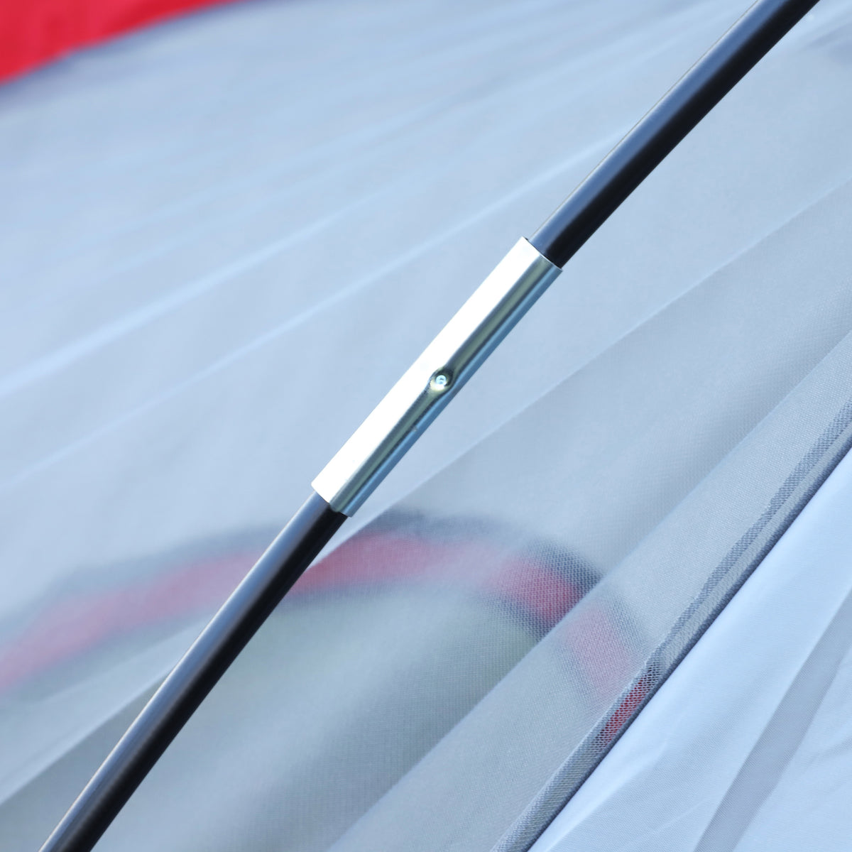 Tent frame pole joint connecting two black poles