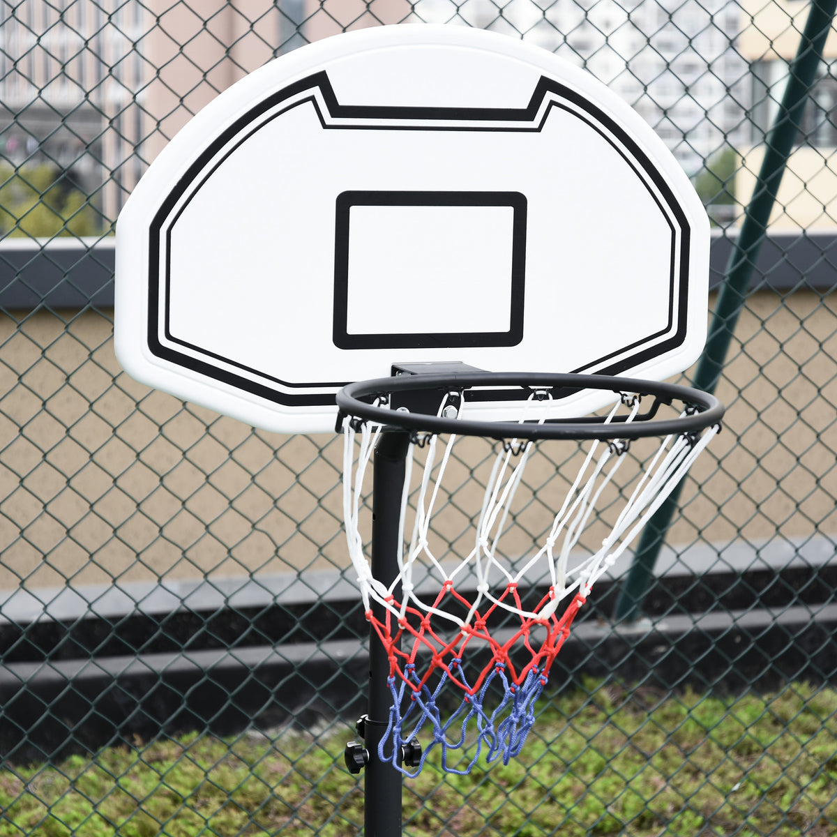 Basketball hoop with white backboard, black rim, and white, red, and blue net