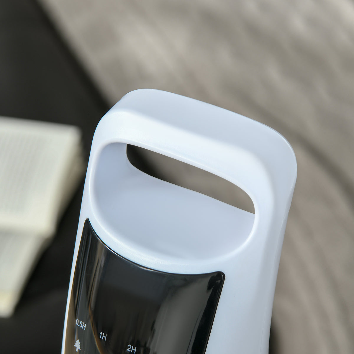 Close-up of the HOMCOM tower fan's integrated carry handle and control panel
