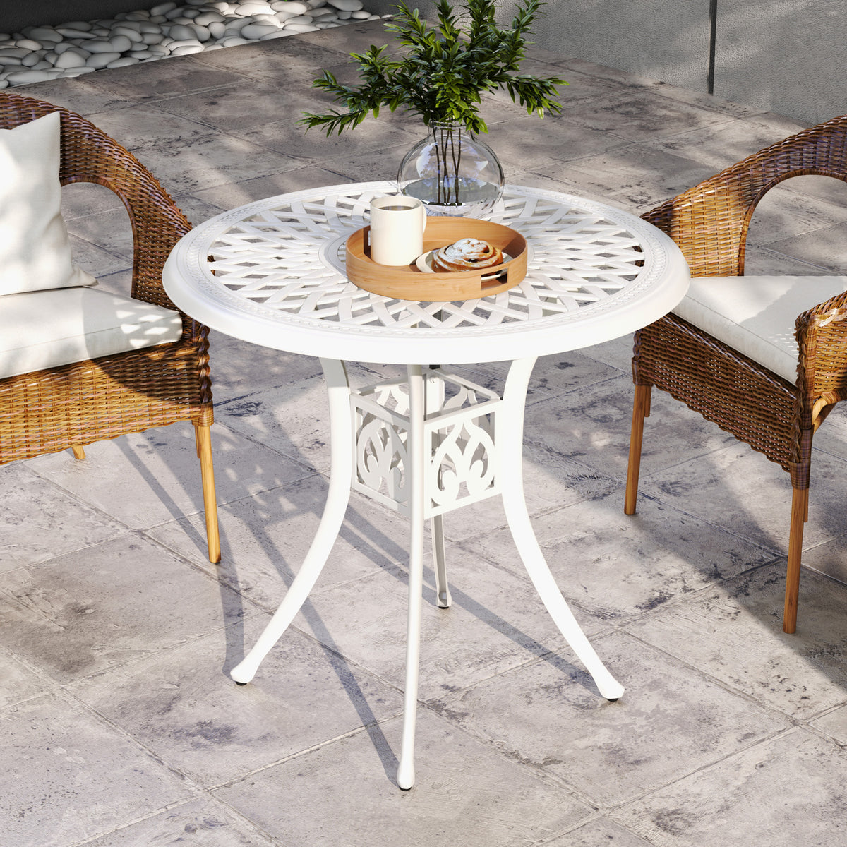 White garden table with a circular lattice top and decorative central base