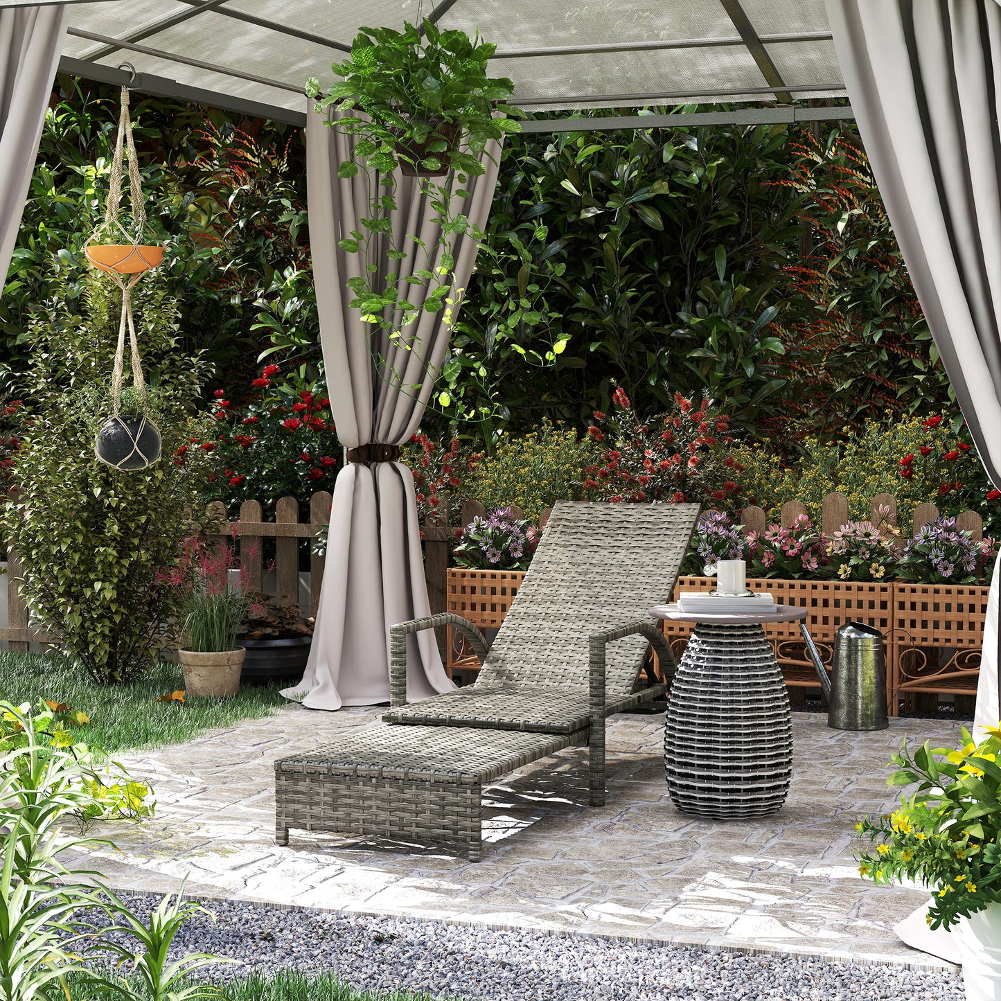 Grey rattan reclining lounger and extended footrest in an outdoor setting