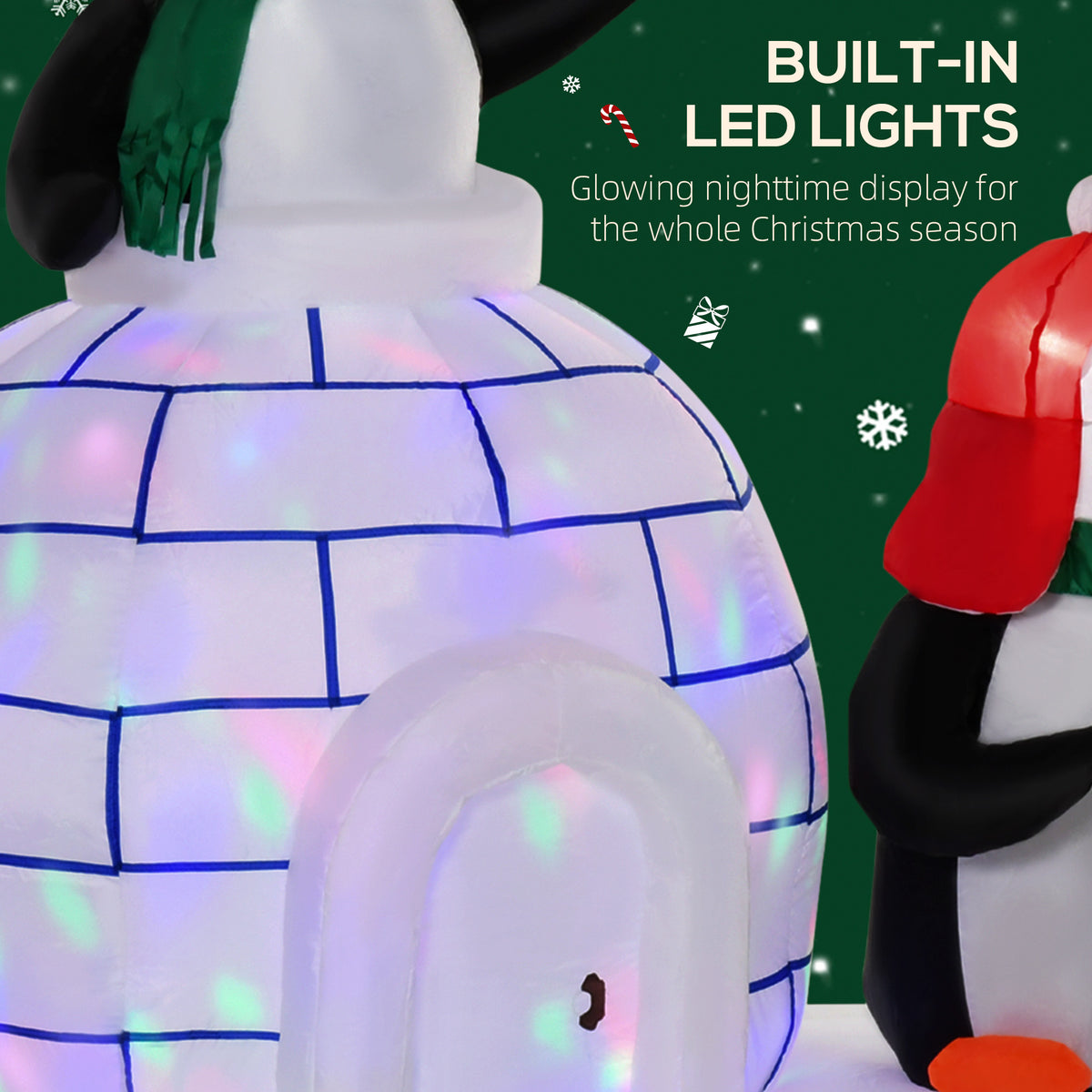 HOMCOM inflatable igloo with blue brick lines and glowing LED lights, flanked by penguins