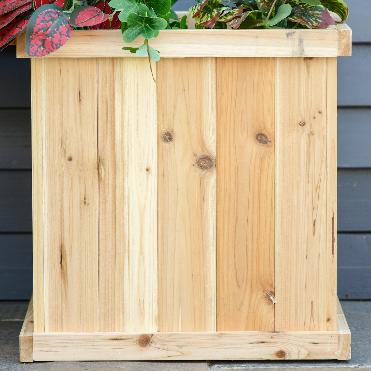 Outsunny wooden raised planter close-up showing vertical boards and solid wood trim
