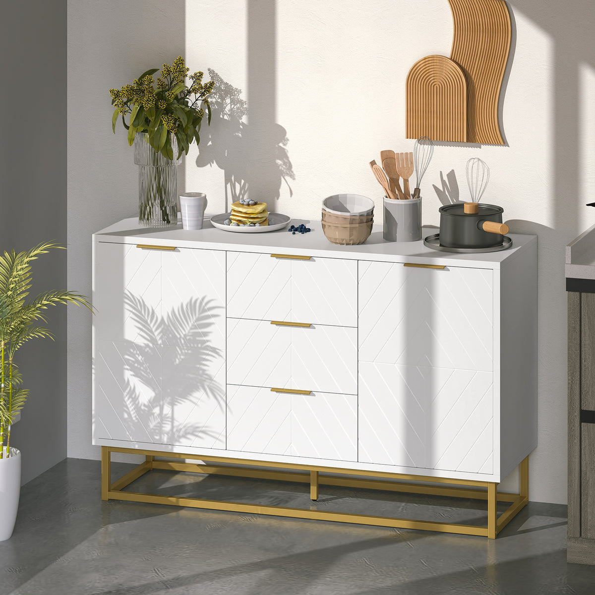 White three-drawer sideboard with patterned cabinet doors and gold-tone metal base