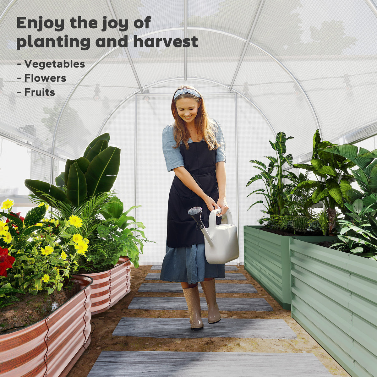 Walk-in polytunnel greenhouse interior with metal frame, raised planters and mesh cover
