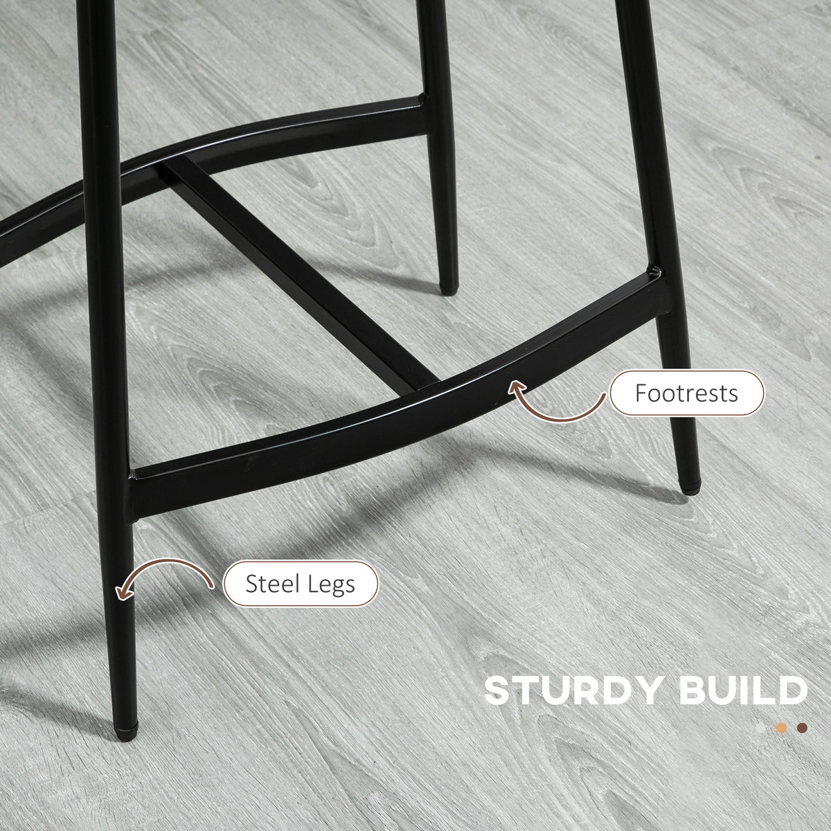 Bar stool with black steel legs and a crossbar footrest