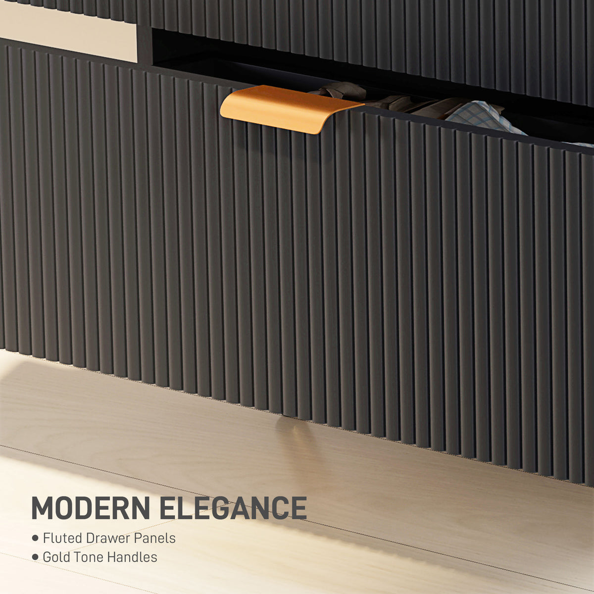 Close-up of a fluted black drawer front and gold-tone handle on the bedside table
