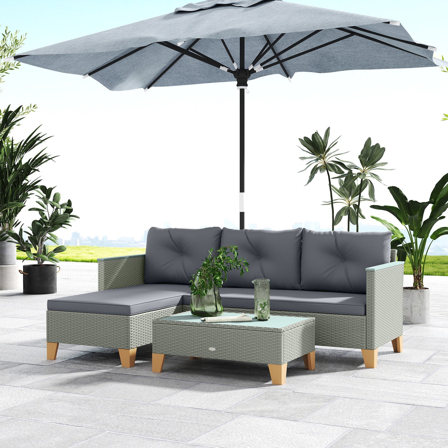 Outsunny rattan sofa set with charcoal cushions and coffee table under a patio umbrella