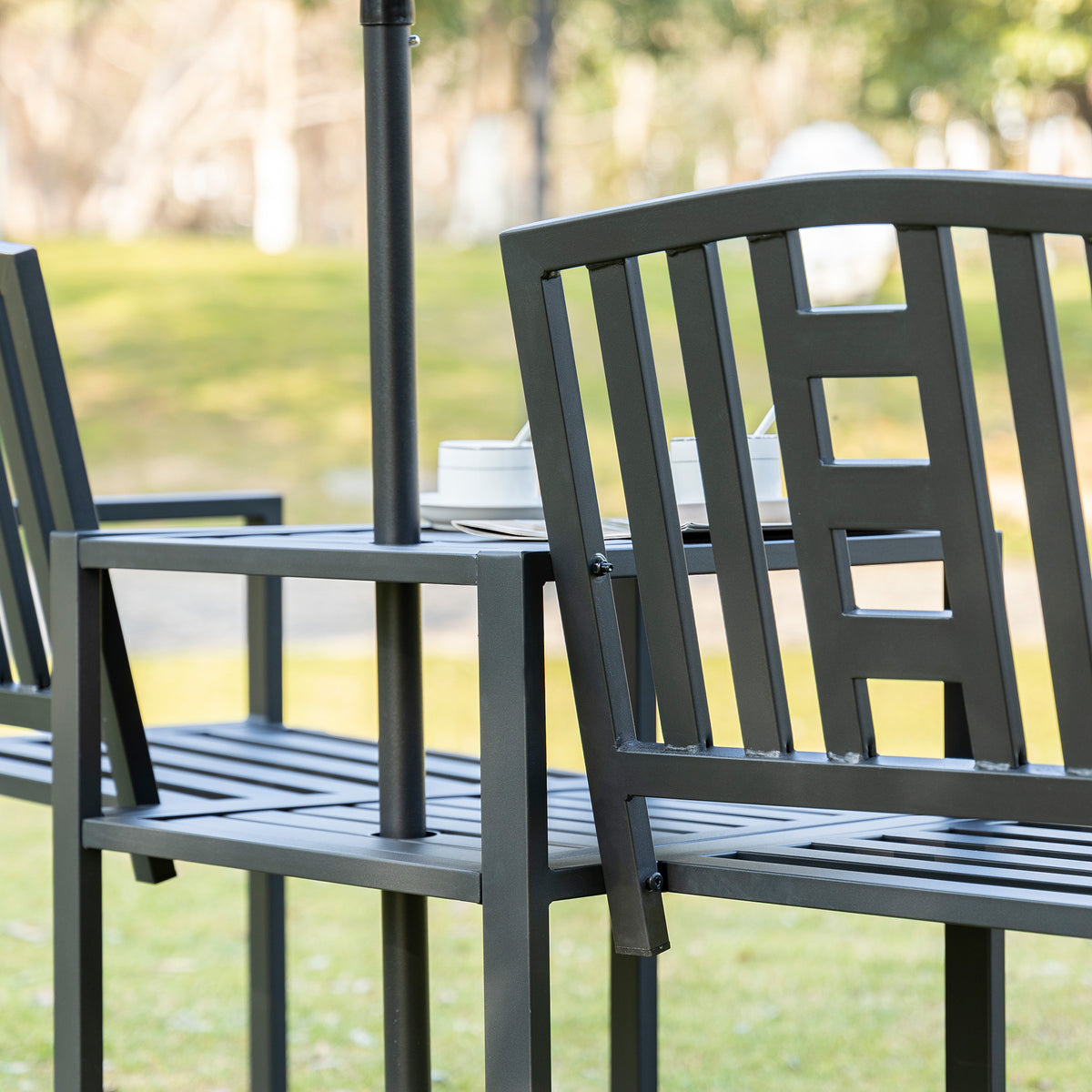 Black slatted garden loveseat with integrated center table and umbrella pole