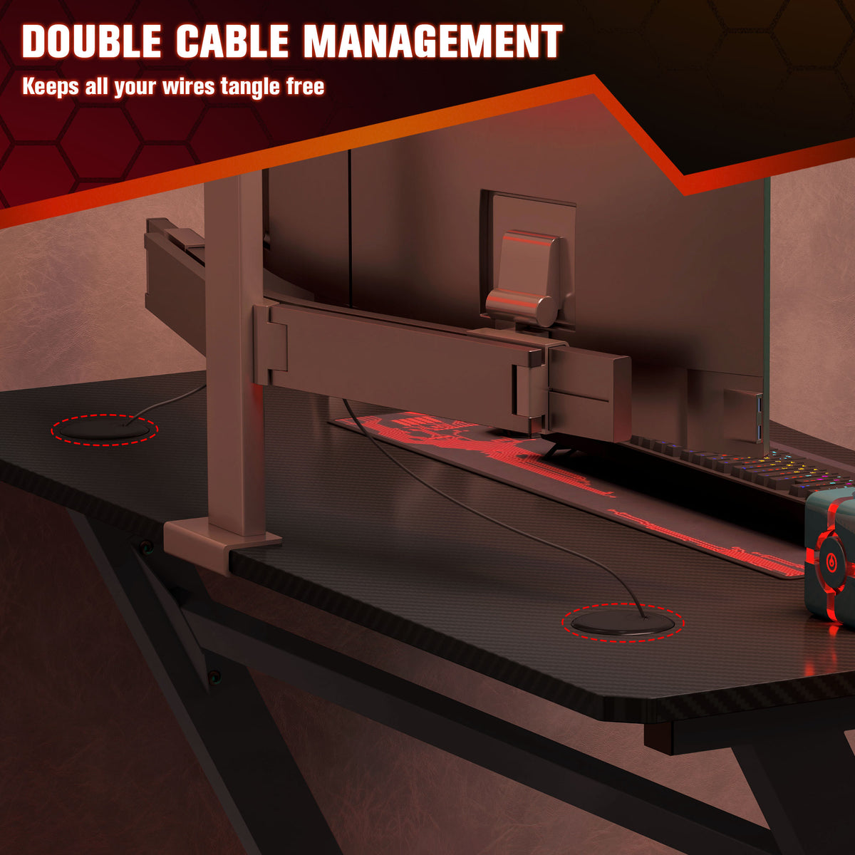 Black gaming desk with dual cable management openings and rear cable tray