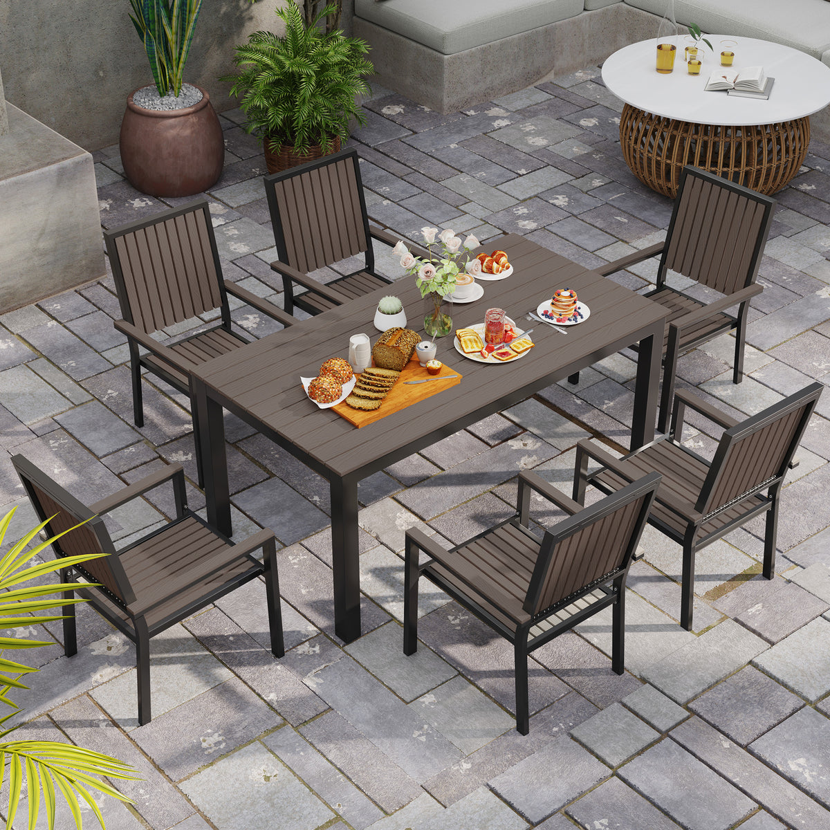 Outsunny garden dining set arranged with six chairs around a rectangular table