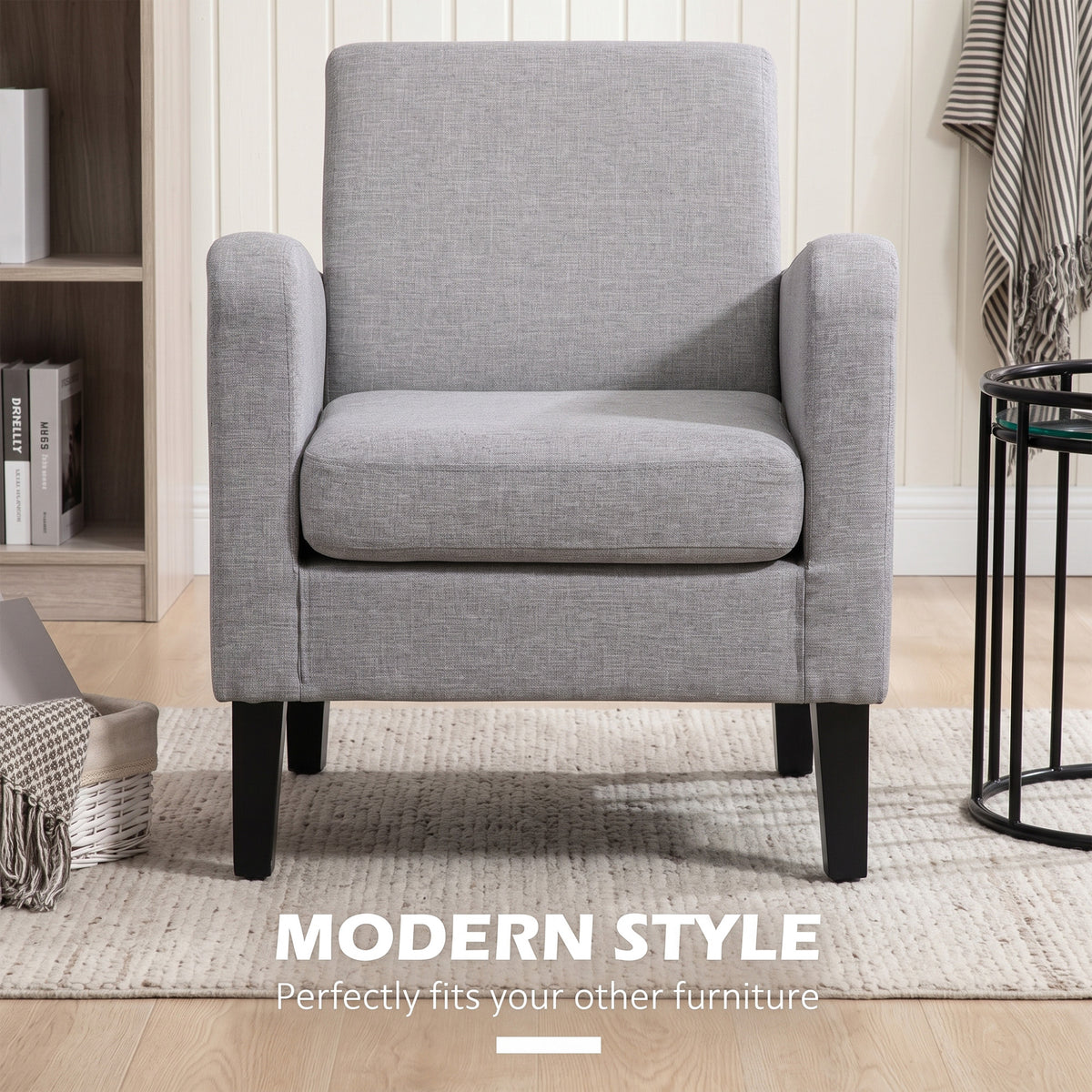 Front view of light grey linen-look armchair with padded seat, boxy arms, and black legs