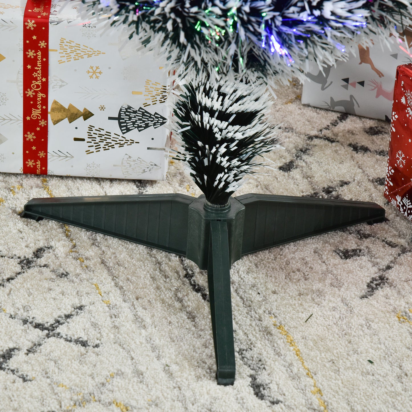 Close-up of the artificial Christmas tree trunk and three-leg stand