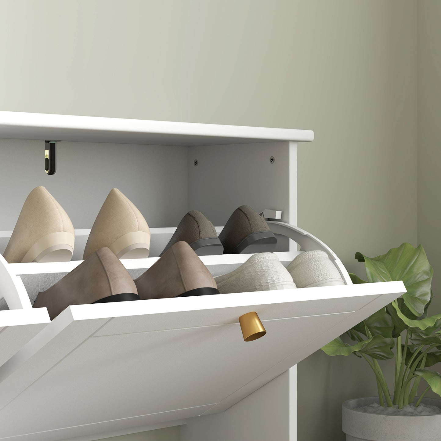 White shoe cabinet flip drawer with gold handle, shown holding shoes