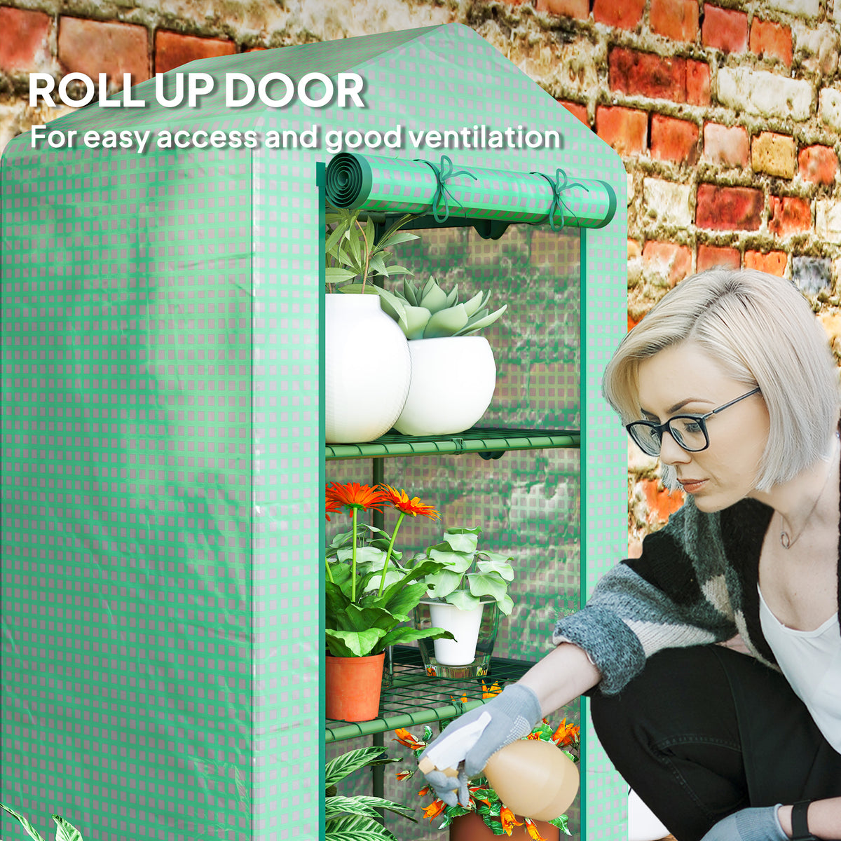Outsunny green mini greenhouse with rolled-up door for access to the plant shelves