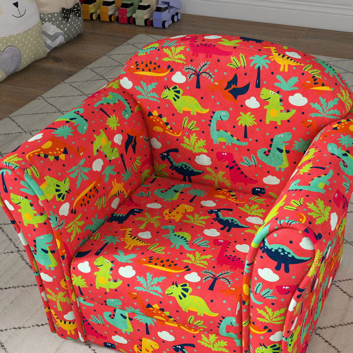 AIYAPLAY red kids armchair with colorful dinosaur-print upholstery, viewed from above