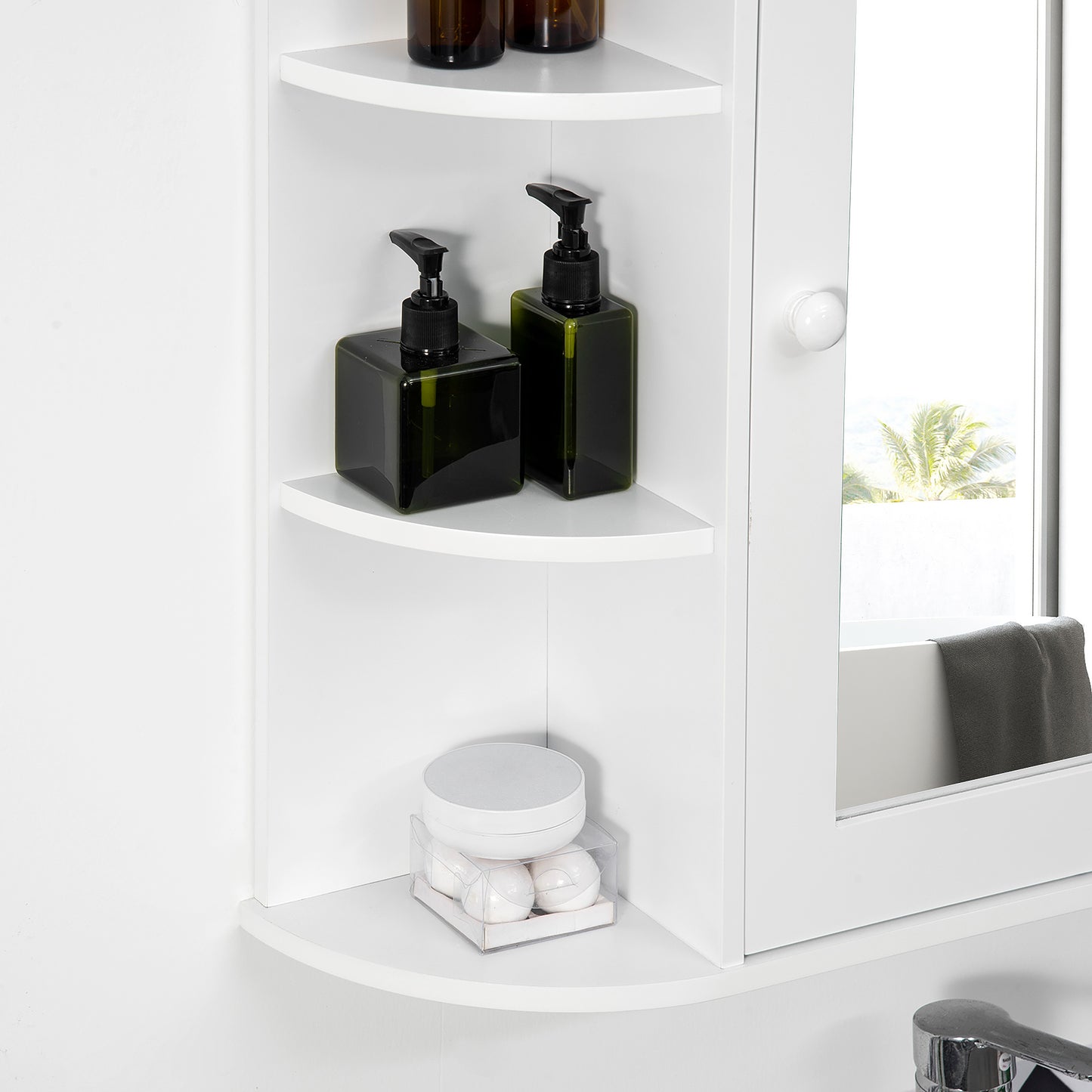 Close-up of white cabinet's curved side shelves beside its mirrored door