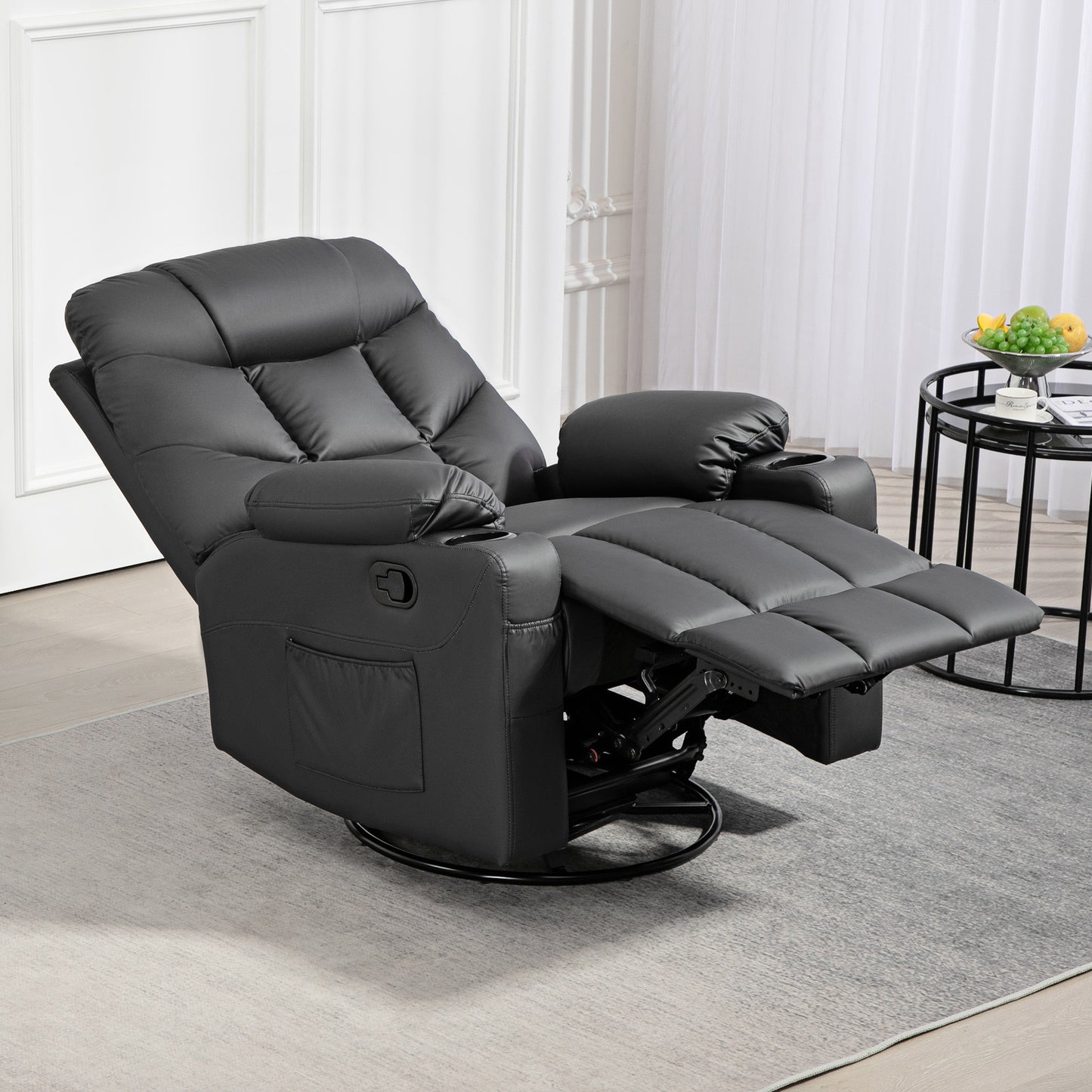 Black HOMCOM manual recliner with extended padded footrest and swivel base