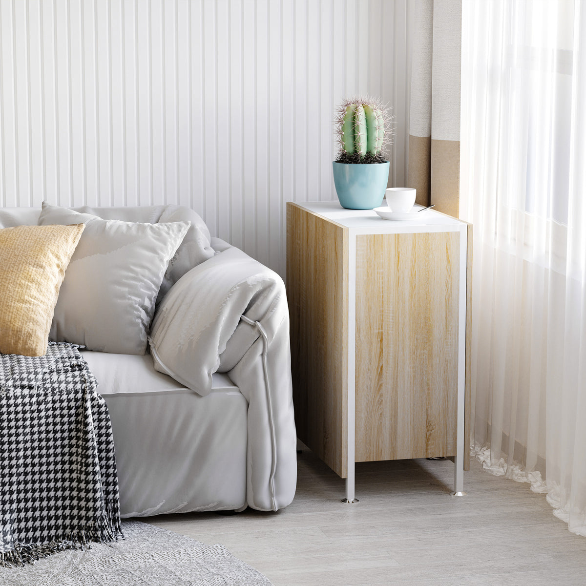 Folded oak-look table with white top used as a compact side table