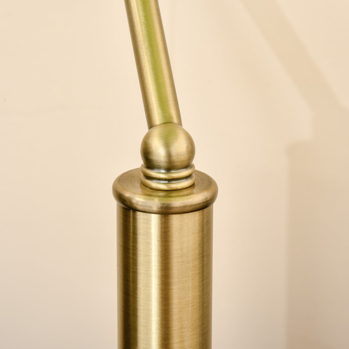 Banker's desk lamp close-up of the bronze-tone stem joint
