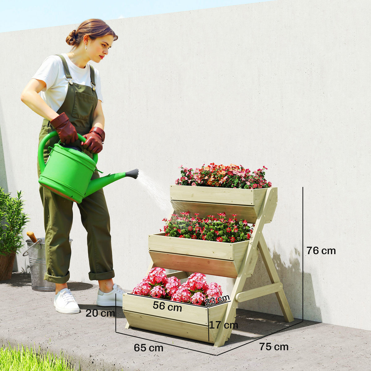 Outsunny three-tier wooden garden planter with dimensions shown beside a person watering it