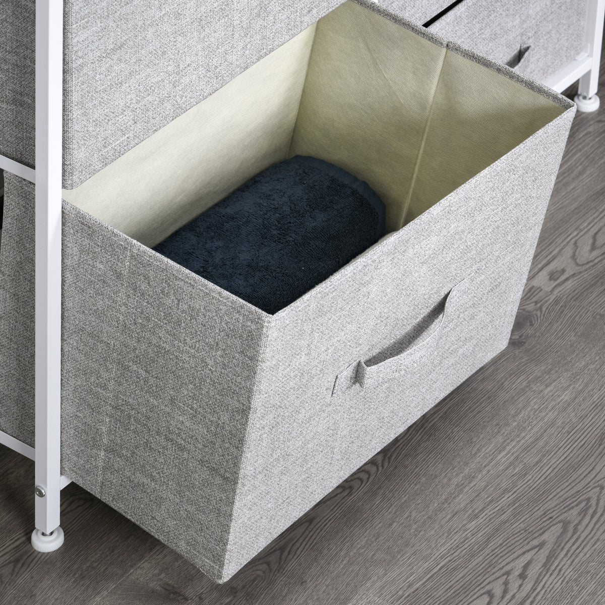 Open gray fabric drawer showing its lined interior and pull handle