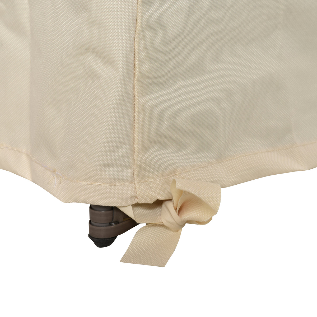 Close-up of a beige sofa cover tie-down strap secured around a furniture leg