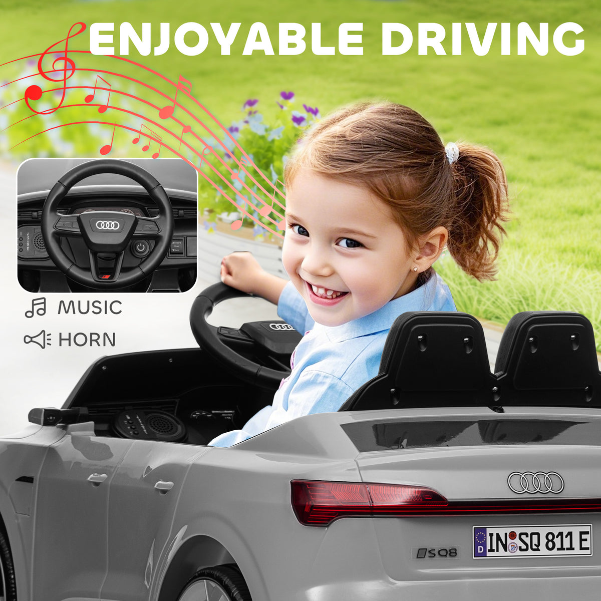 Grey Audi ride-on car shown from the rear with a child at the wheel
