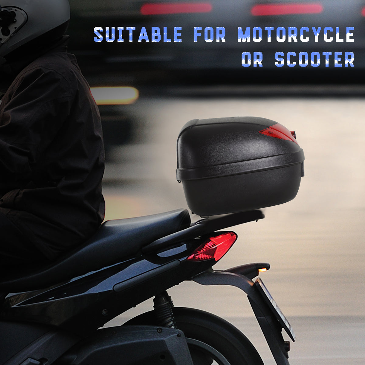 Black motorcycle top box mounted behind a scooter seat, with a red rear reflector