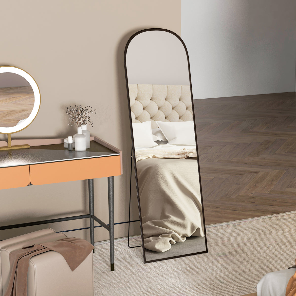 Full-length black-framed mirror with rounded top and rear support stand.