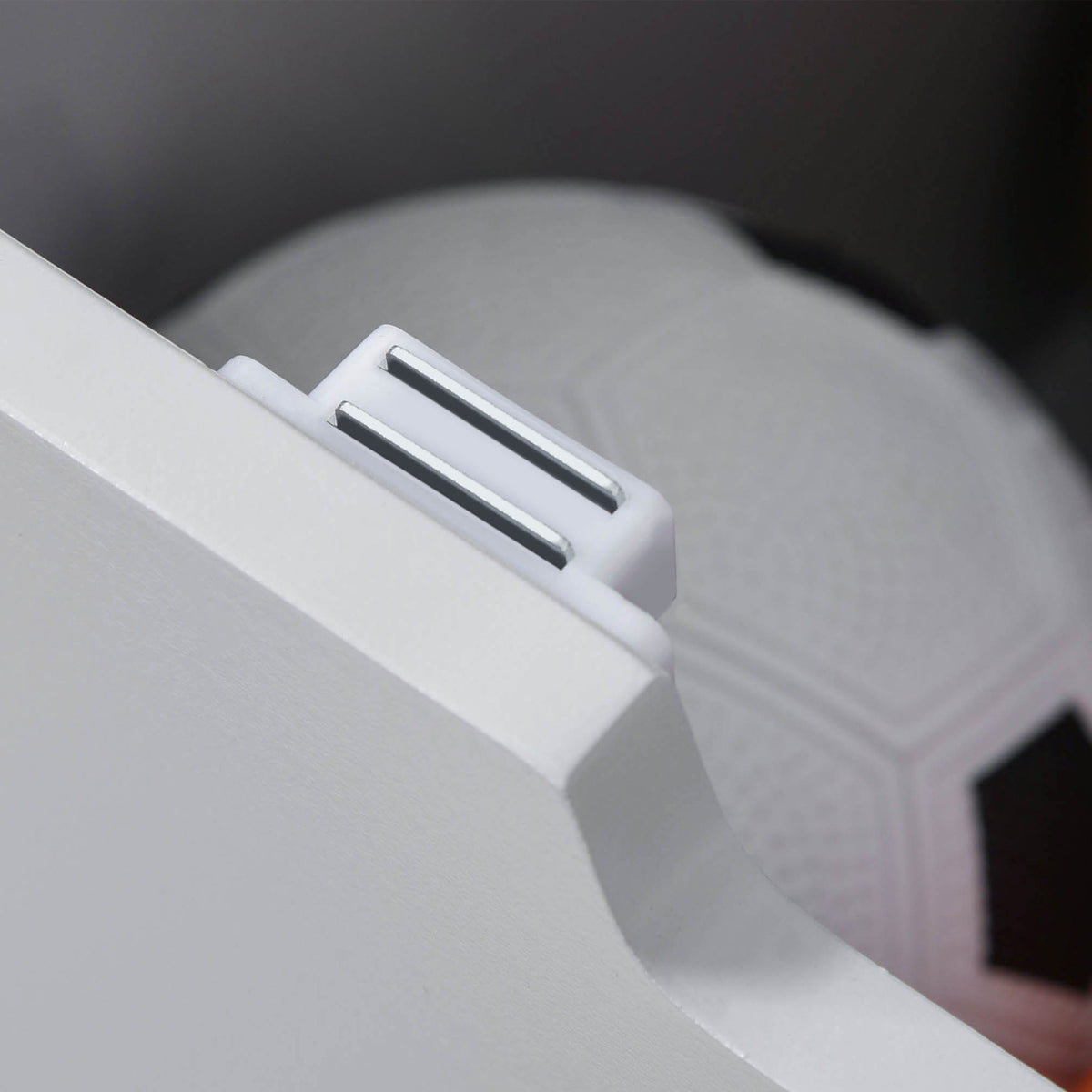 Close-up of the toy chest's magnetic lid lock