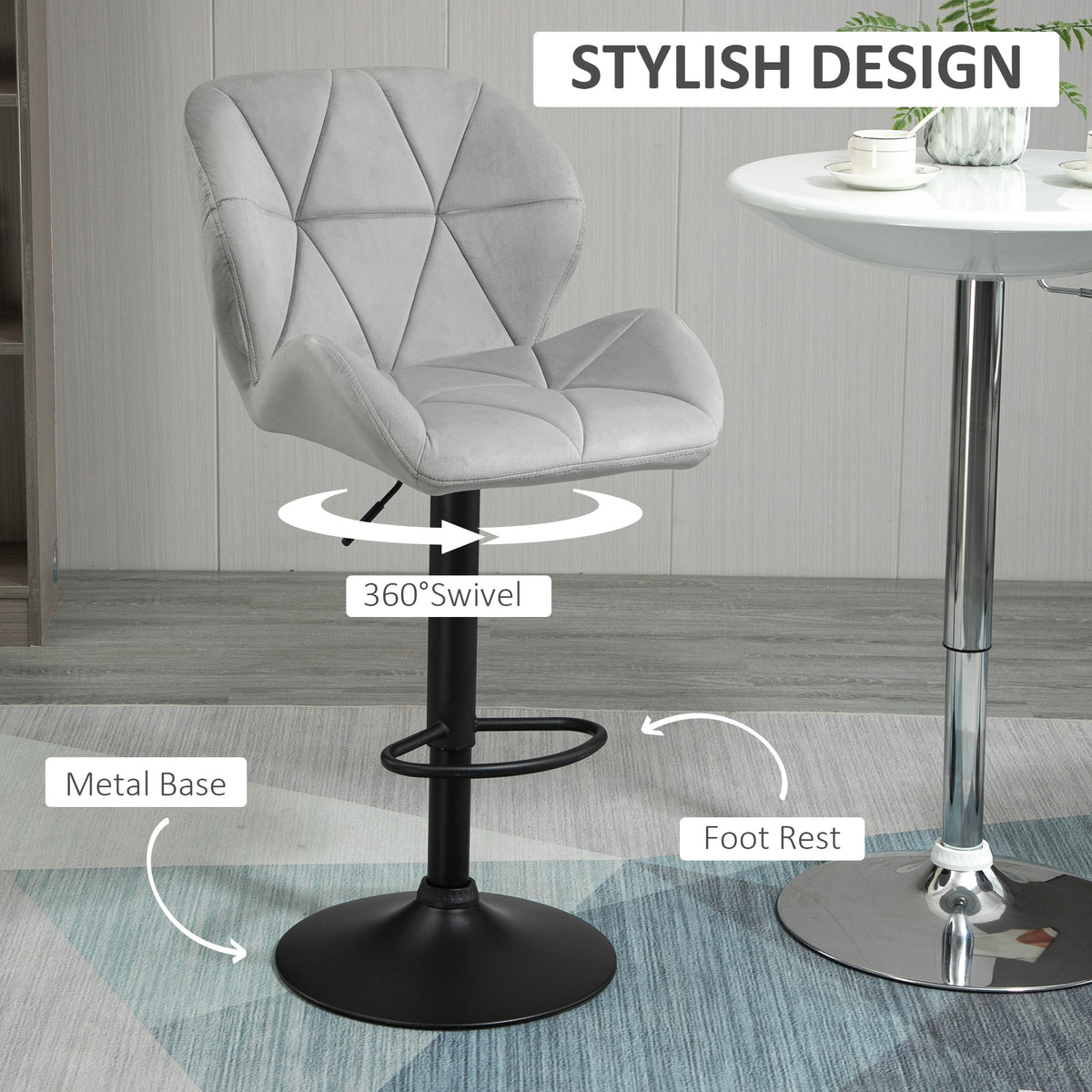 Light gray swivel bar stool with padded tufted seat, black metal base and footrest