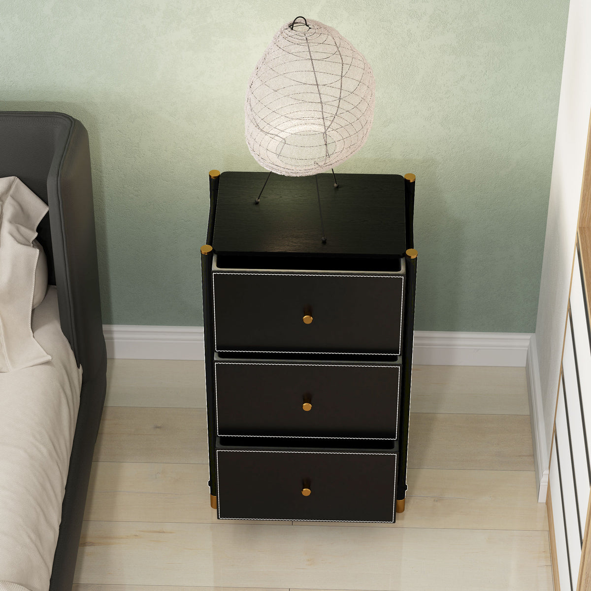 Black three-drawer chest viewed from above, with all drawers open