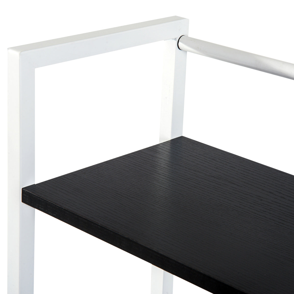 Close-up of black wood-grain desk shelf and white metal frame