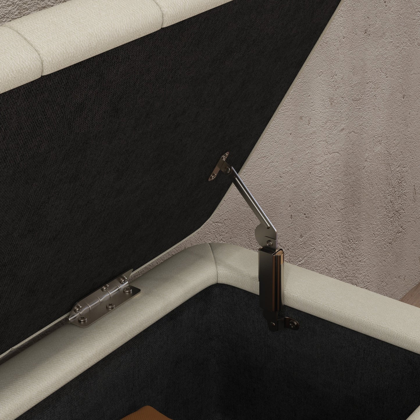 Close-up of the open ottoman's metal lid hinge and support mechanism